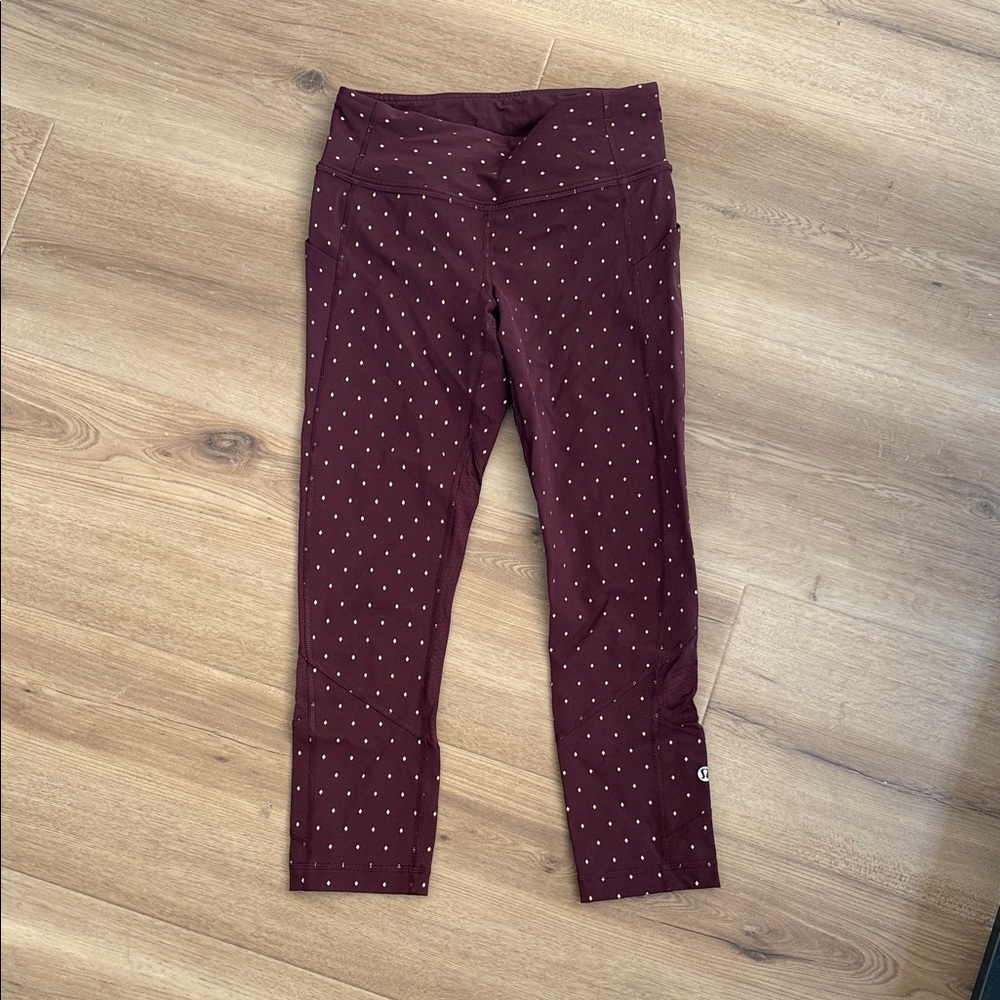 Size 4 Lululemon maroon and gold capri running leggings